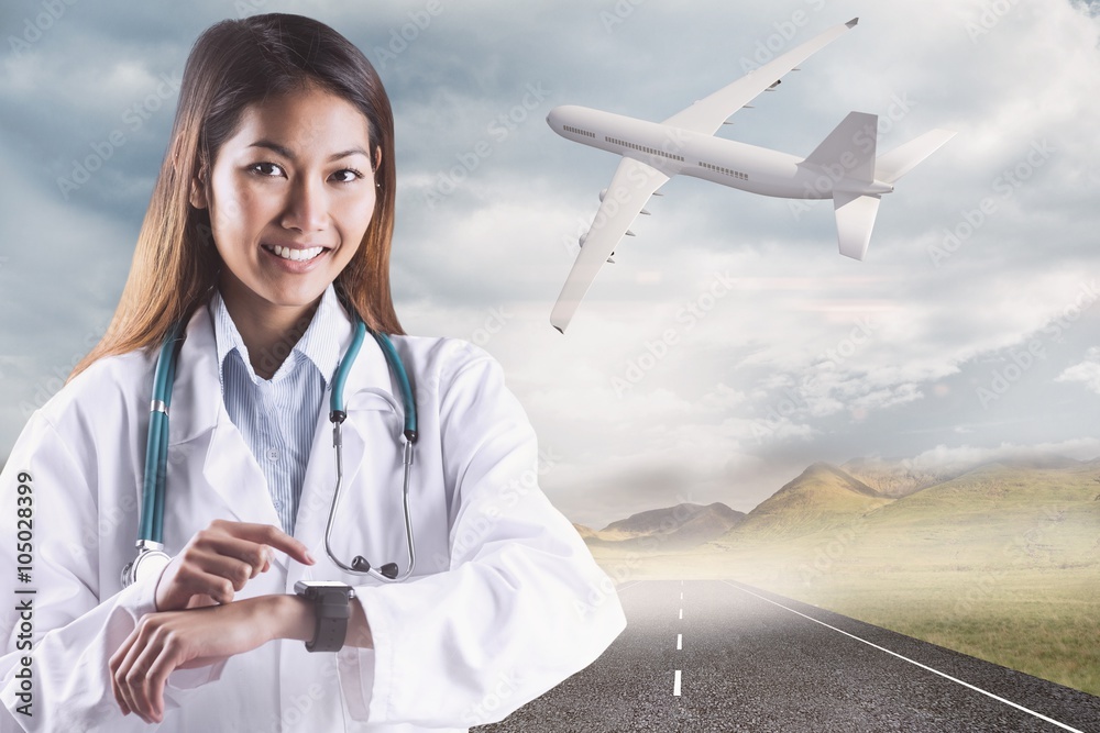 Composite image of asian doctor using her smart watch