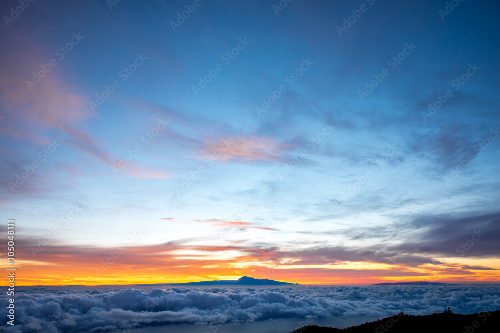 Beautiful cloudscape with Tenerife island on background on the sunrise in Spain