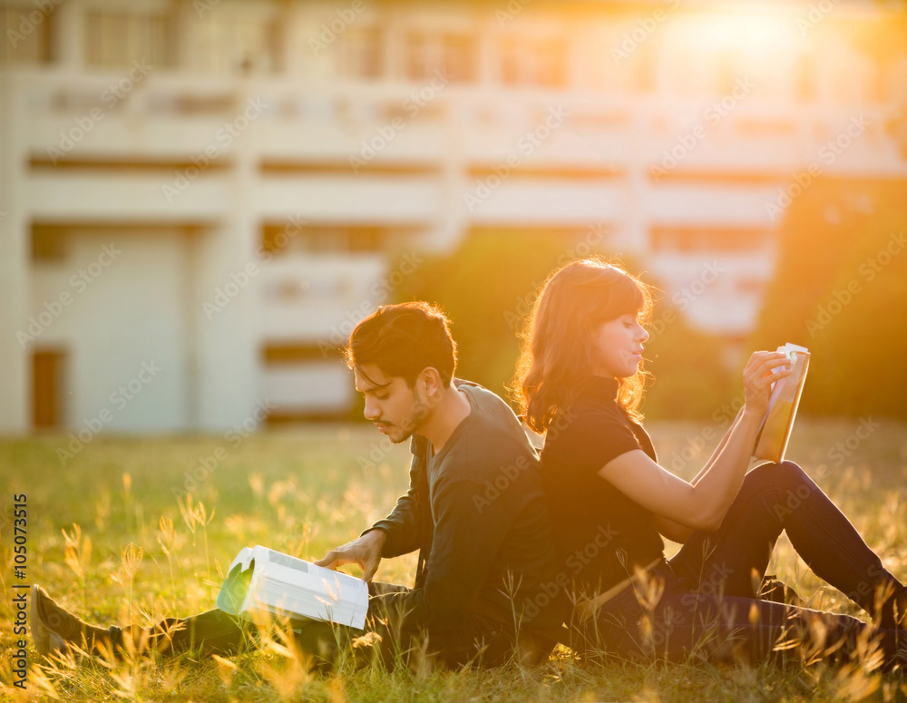 Student was reading in the outdoors and good weather. And theyr