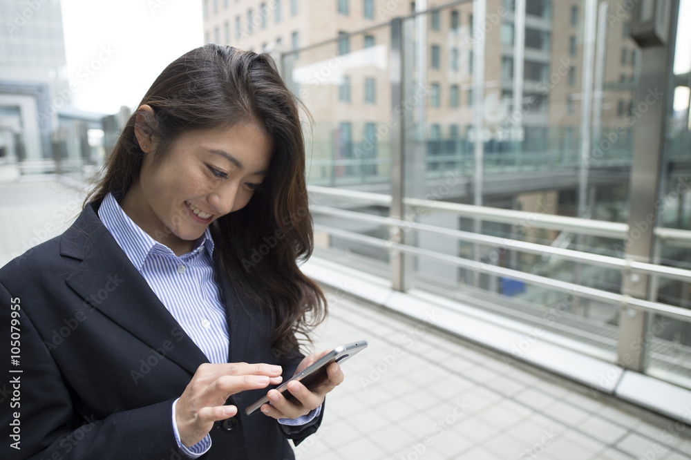 Women wearing the suit have a smartphone