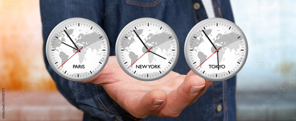 Businessman holding time of the world in his hand