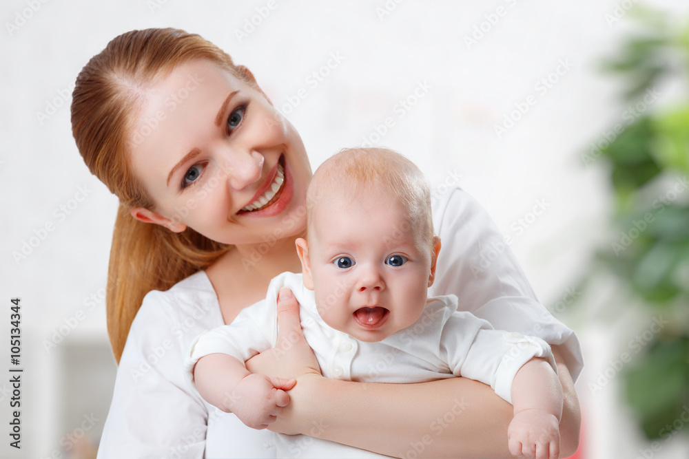 happy family mother hugging her baby