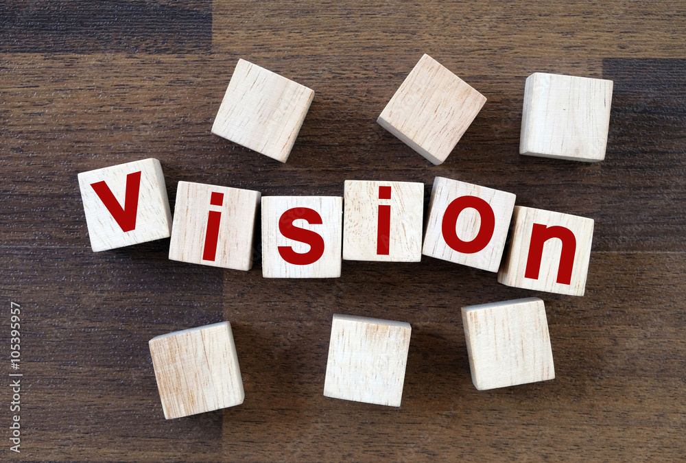 Vision word on wooden cubes background