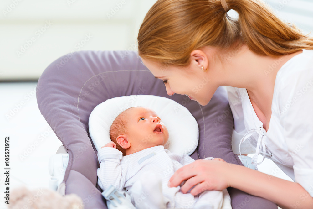 happy family. mother plays with newborn baby