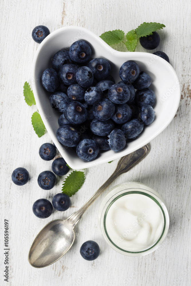 Healthy breakfast of muesli, berries with yogurt and seeds