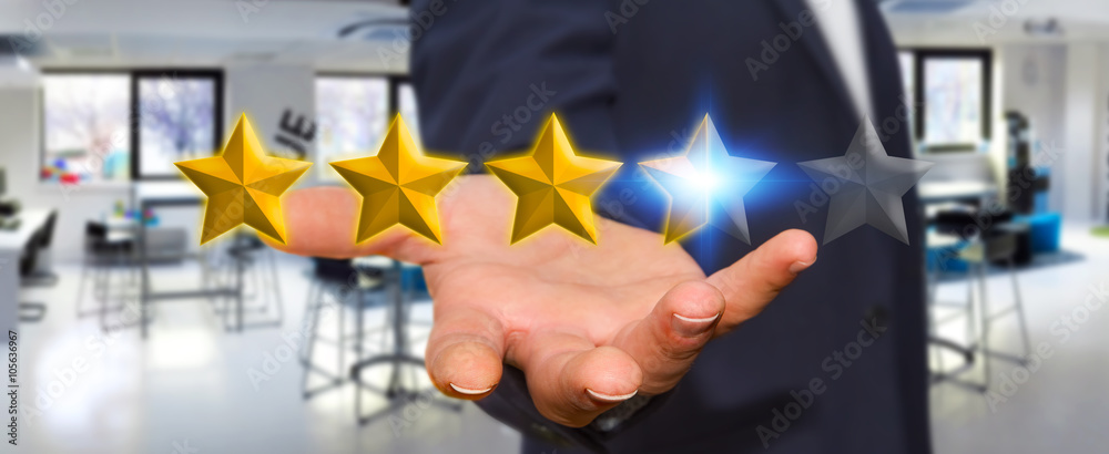 Businessman rating stars with his hand