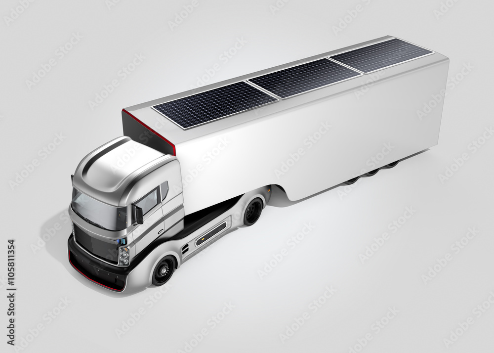 Hybrid electric truck isolated on gray background. Top of cargo container there are solar panels for