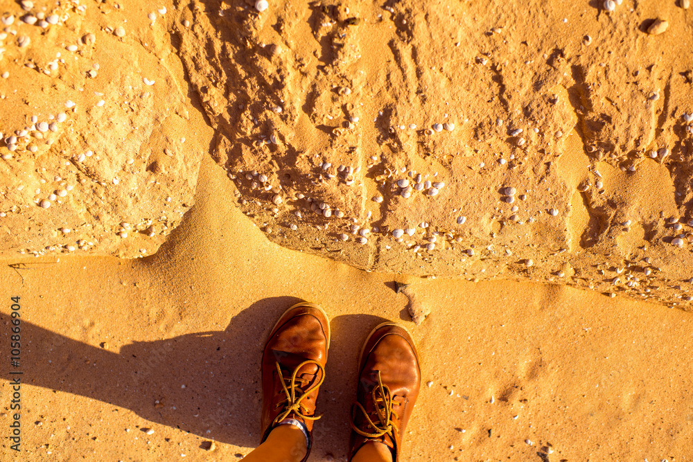 Standing on the dried riverbed with shells on Fuerteventura island in Spain 