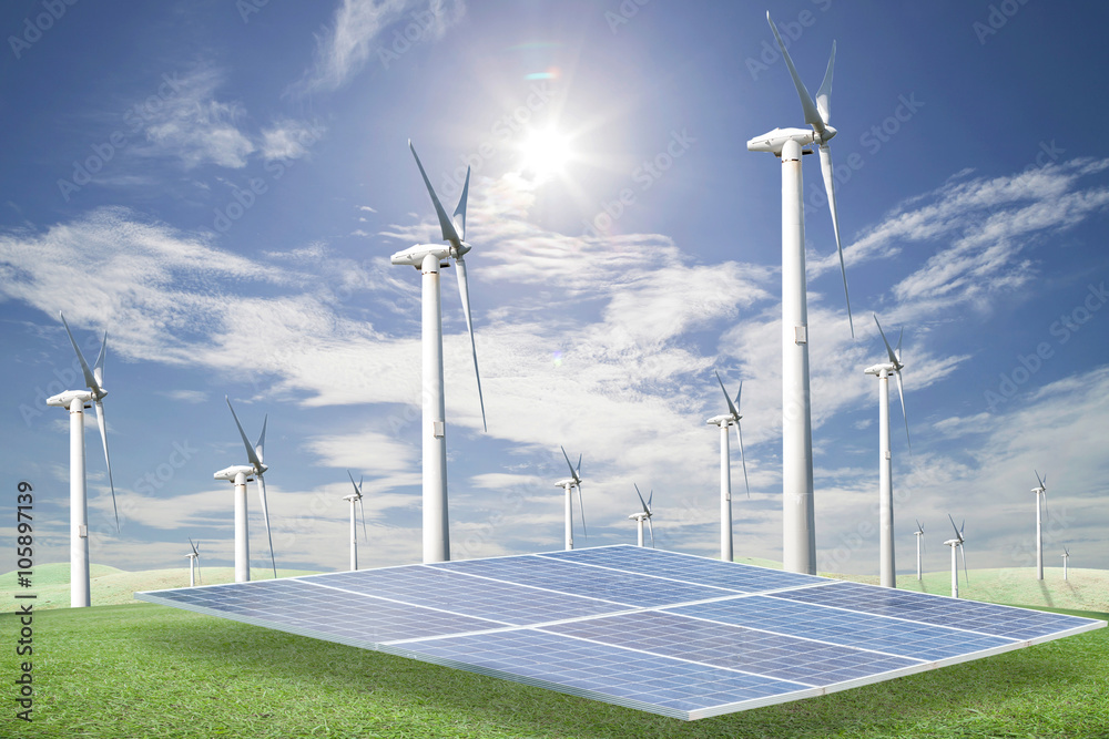 Solar panels,wind turbines on green grass with blue sky backgrou