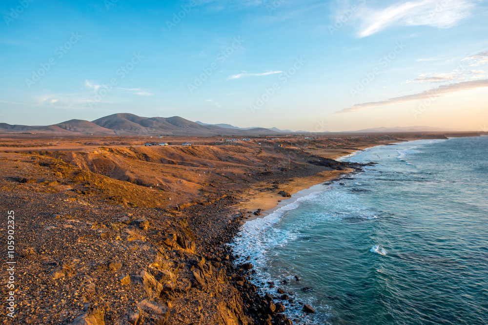 Coastline near El Cotillo village on Fuerteventura island on the sunset in Spain