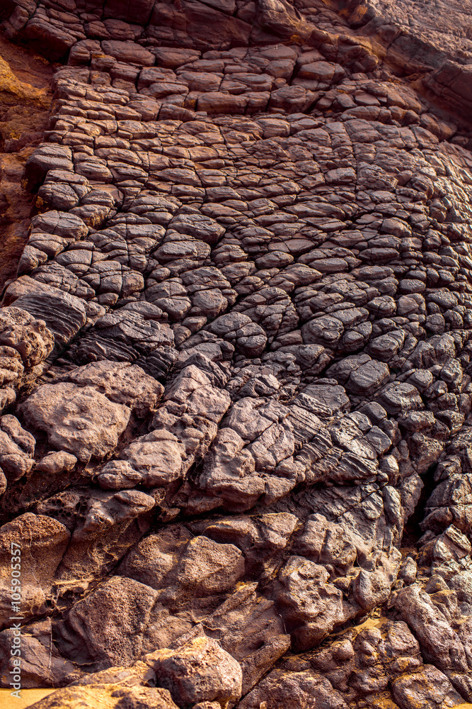 Close-up view on the volcanic rocky coast near La Pared village on the south western part of Fuertev