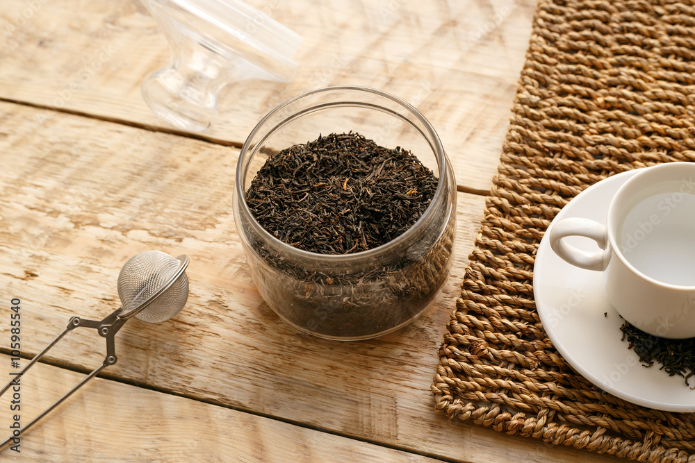 Tea set on the wooden table at sunny morning