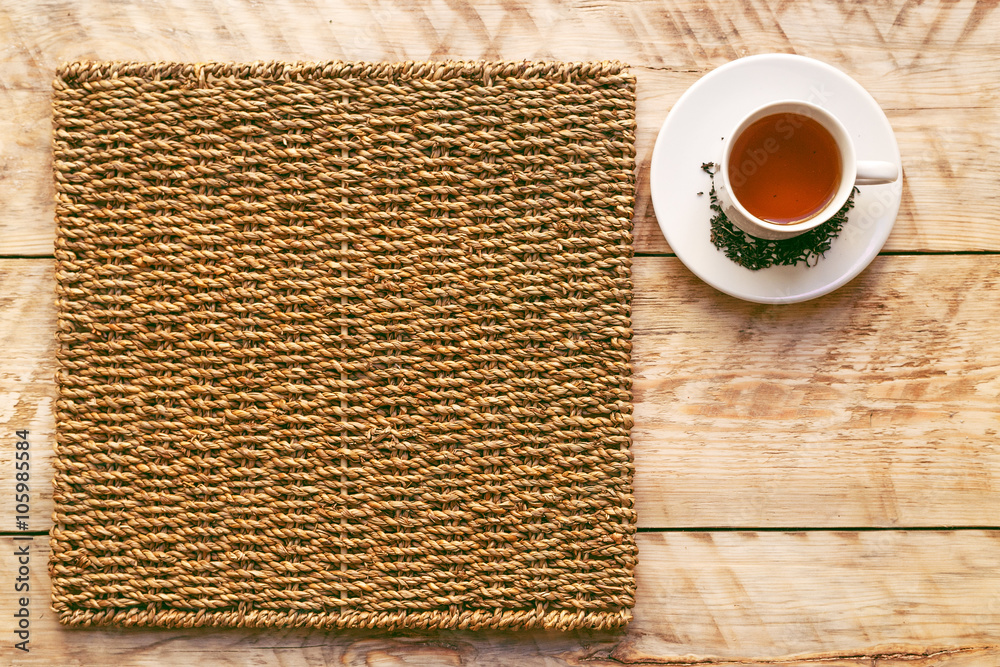 Tea set on the wooden and straw background mockup