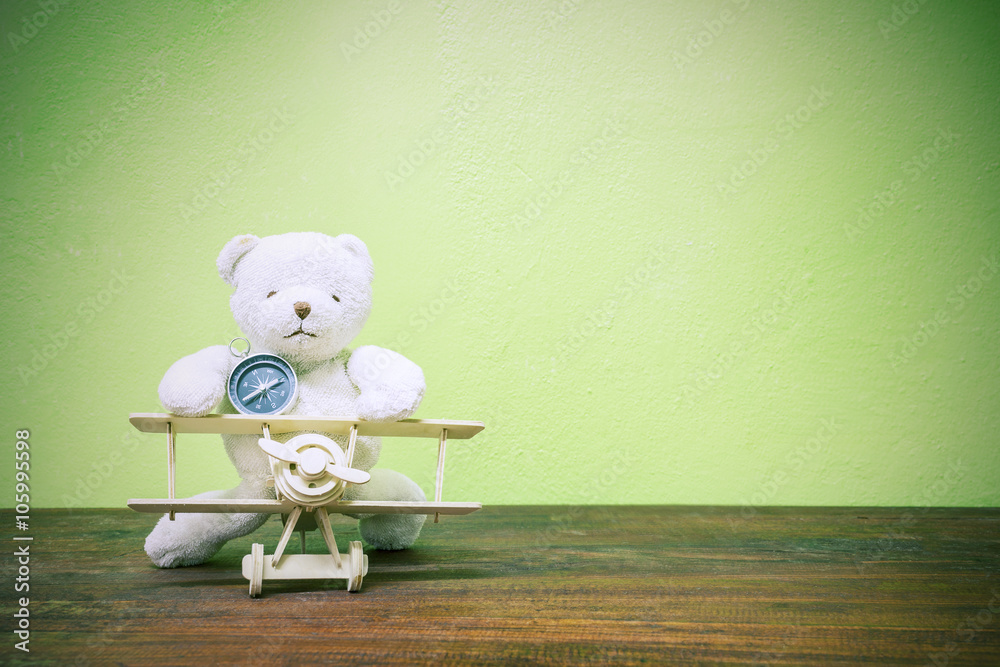  teddy bear ride Wood airplane and compass ,on old wood  and gre