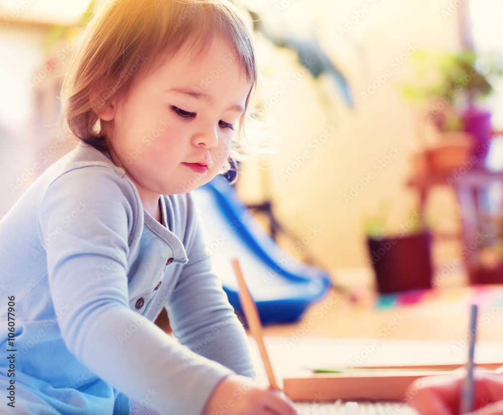 Toddler girl drawing picture