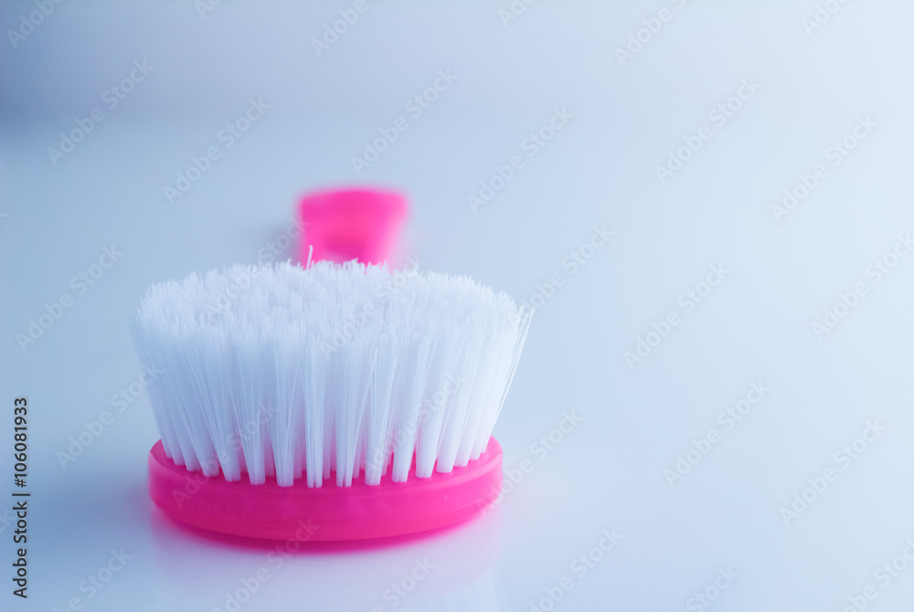 plastic body brush on white background