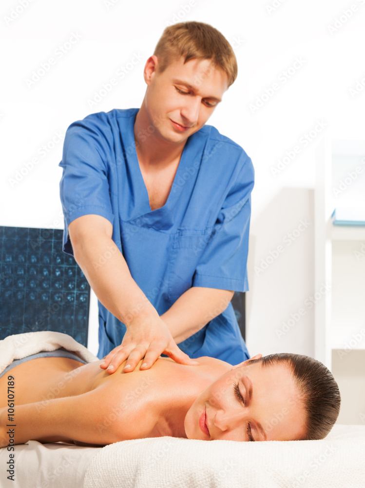 Picture of happy beautiful woman in massage salon