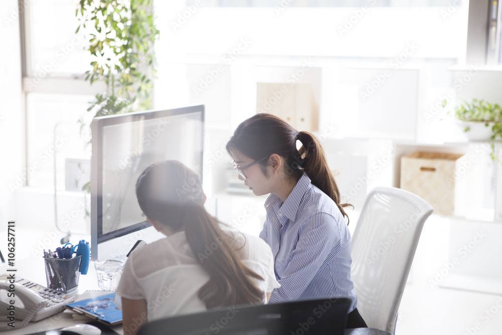 Company employee is talking happily with a colleague next to the seat