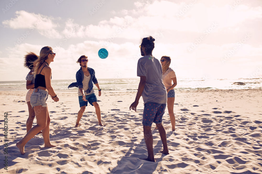 Happy friends having fun on the beach