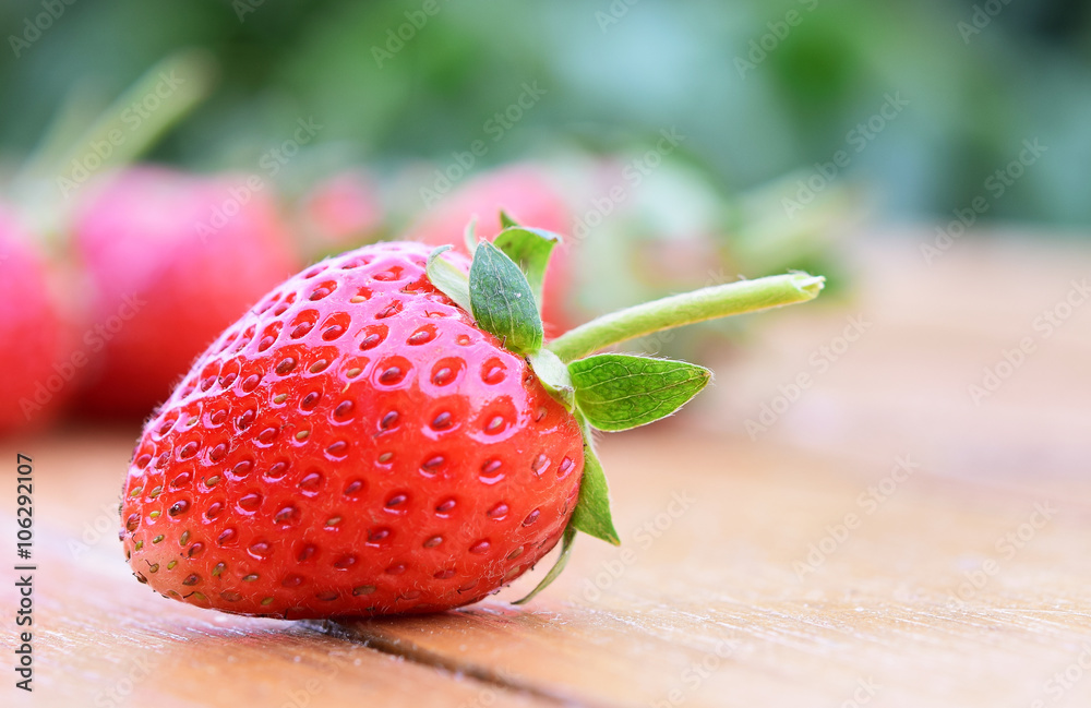 Close up strawberries on the wooden background