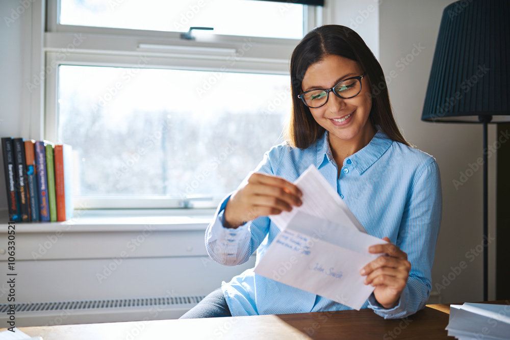 Young business entrepreneur checking her mail