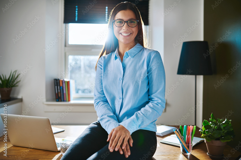 Relaxed confident young businesswoman