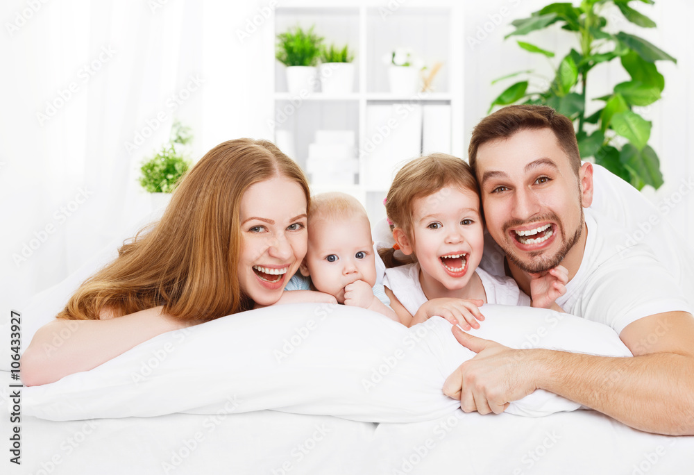 happy family at home in  the bed