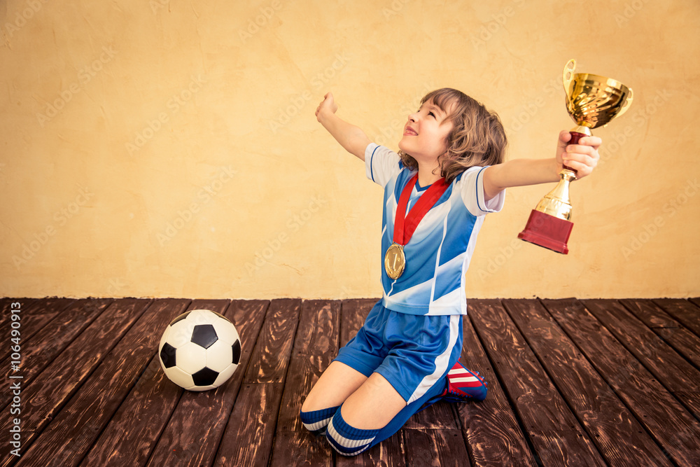 Child is pretending to be a soccer player