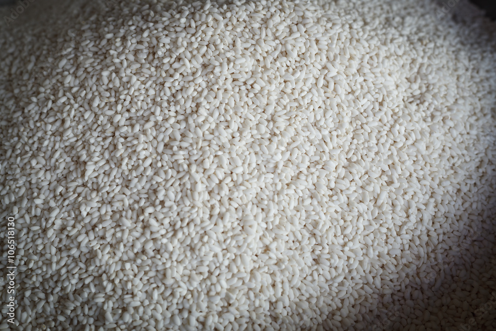 Rice background. Uncooked raw cereals on market. Macro.