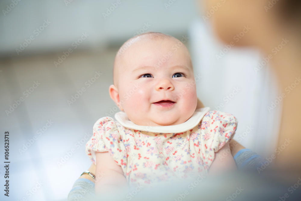 Smiling newborn baby girl