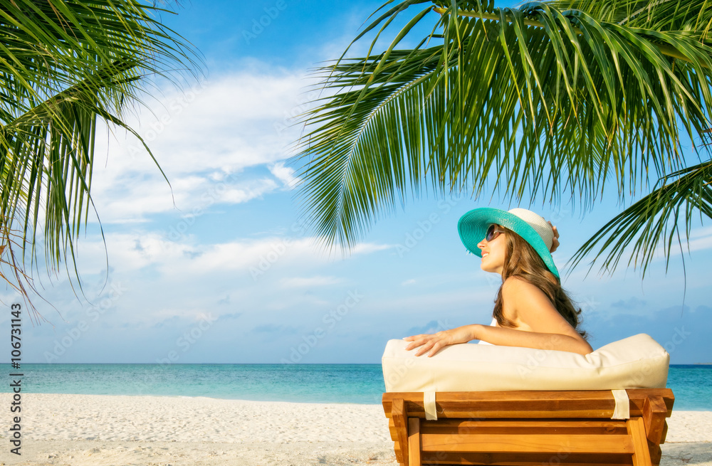 Woman relaxing on deckchair