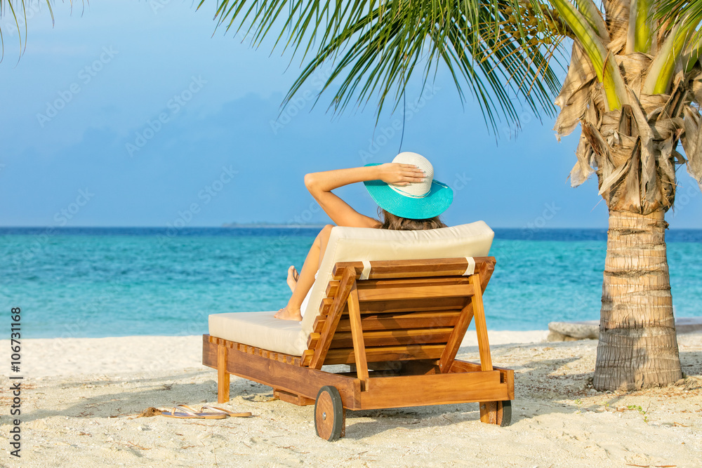 Woman relaxing on deckchair