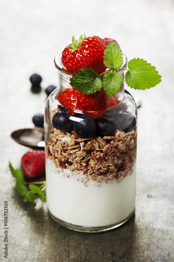 Yogurt with baked granola and berries