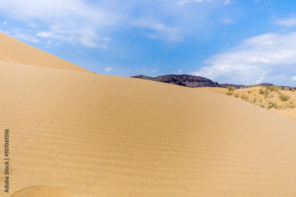 sand dune on a background of mountains