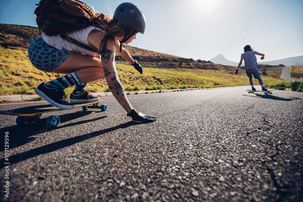 Young woman skating with her friend