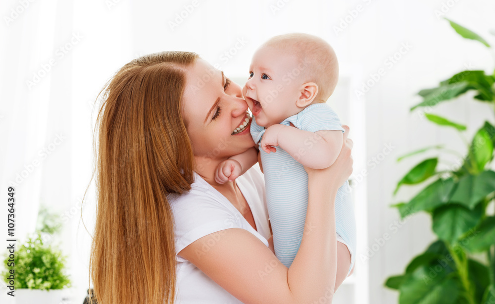 . happy family mother playing  with baby