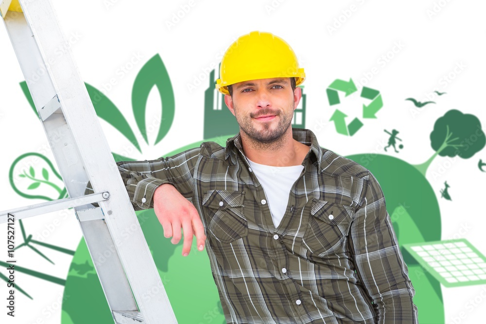 Composite image of smiling handyman in overalls 