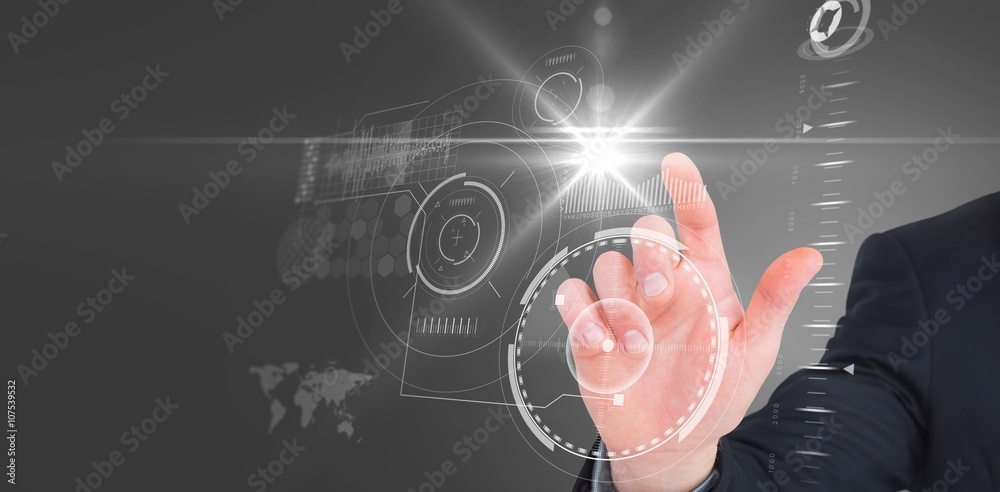 Composite image of focused businessman pointing with his finger