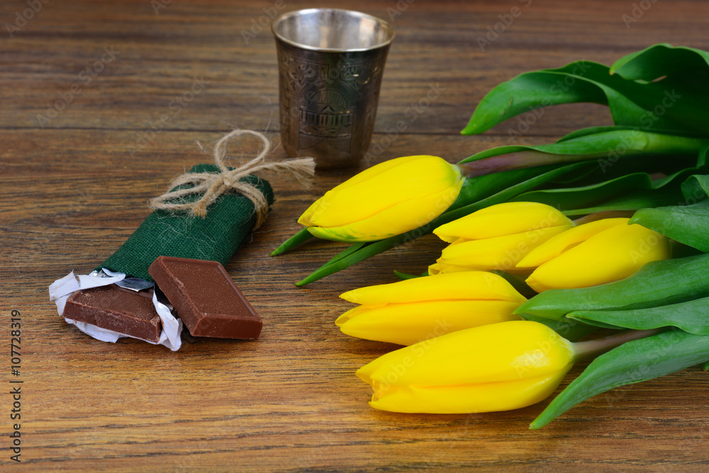 Beautiful Yellow tulips on Wood Background