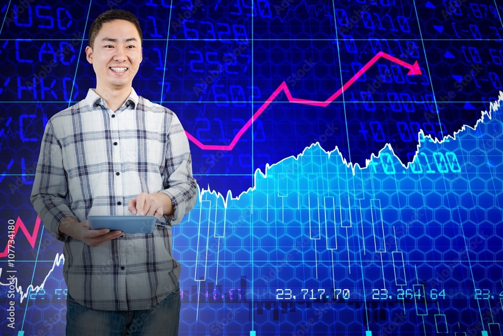 Composite image of happy man using tablet computer