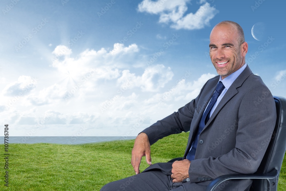 Composite image of portrait of confident businessman