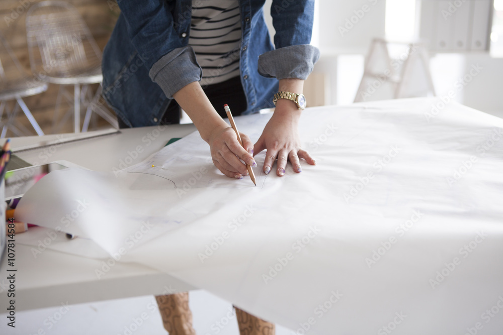 Women are making the clothes of the pattern in the studio