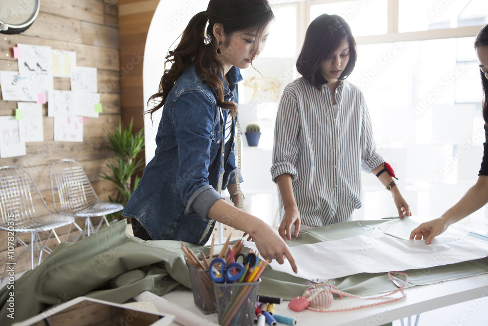 Female pattern makers are working in the studio