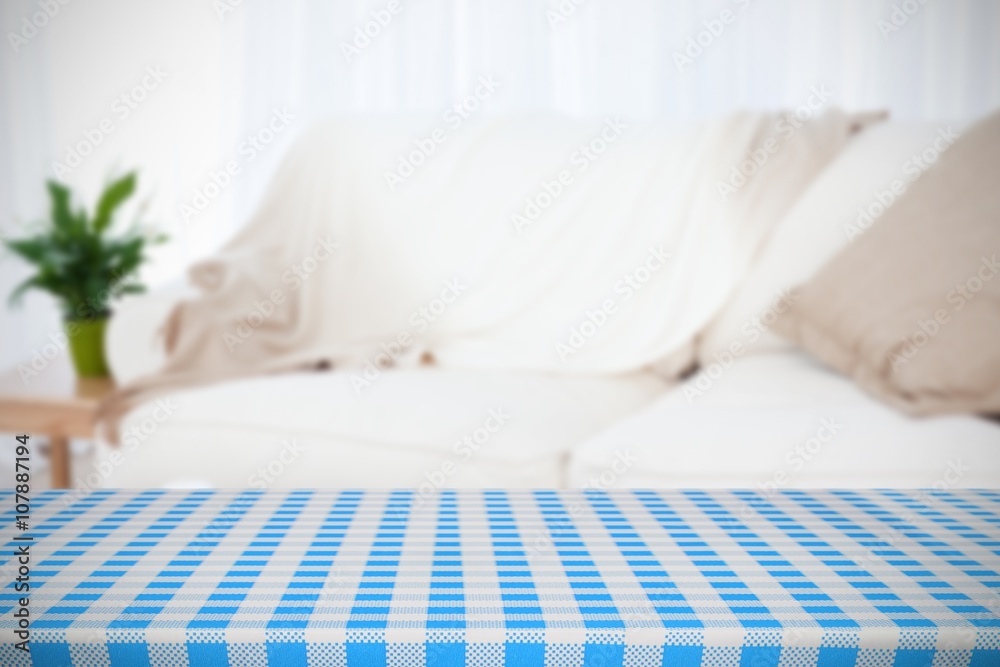 Composite image of part of blue and white tablecloth