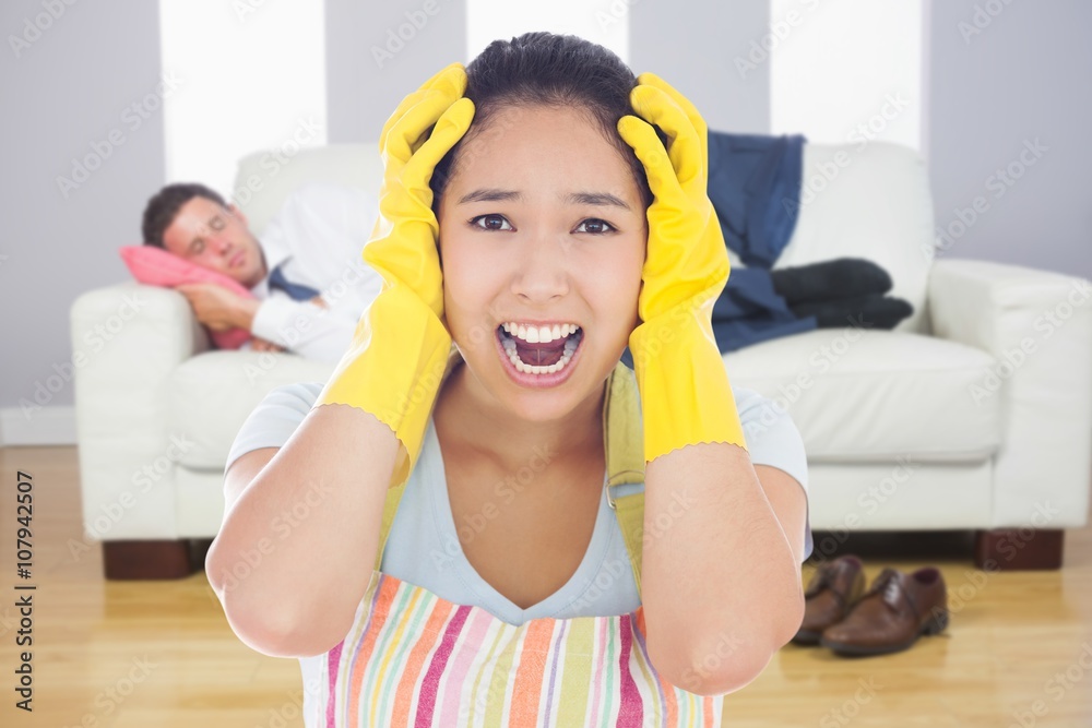 Composite image of distressed woman wearing apron