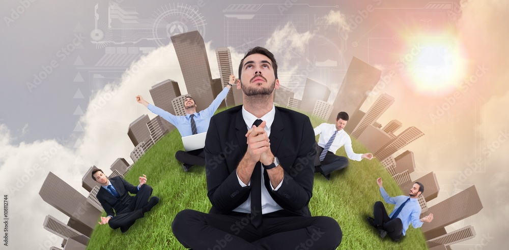 Businessman sitting praying and looking up