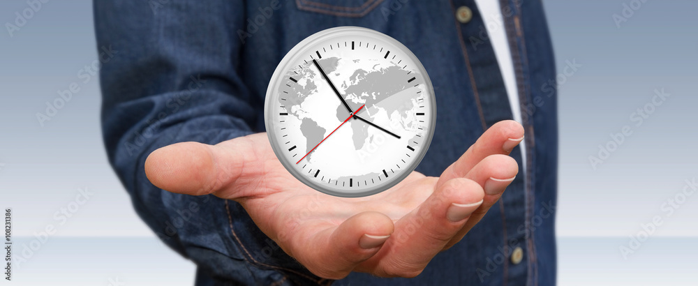 Businessman holding a clock in his hand