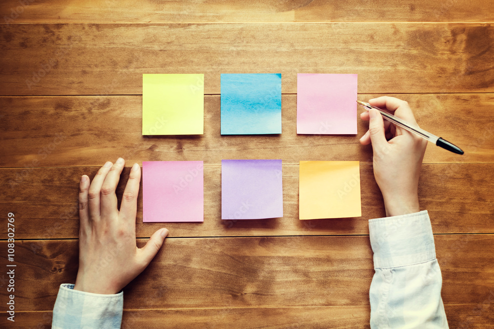 Person organizing things at a desk