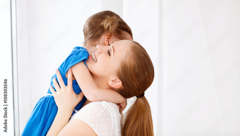 Happy loving family. mother and child laughing and hugging