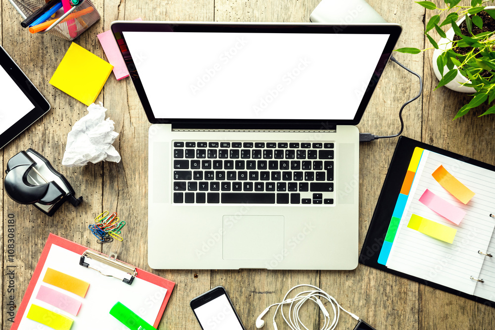 Laptop with other modern electonic devices on desk